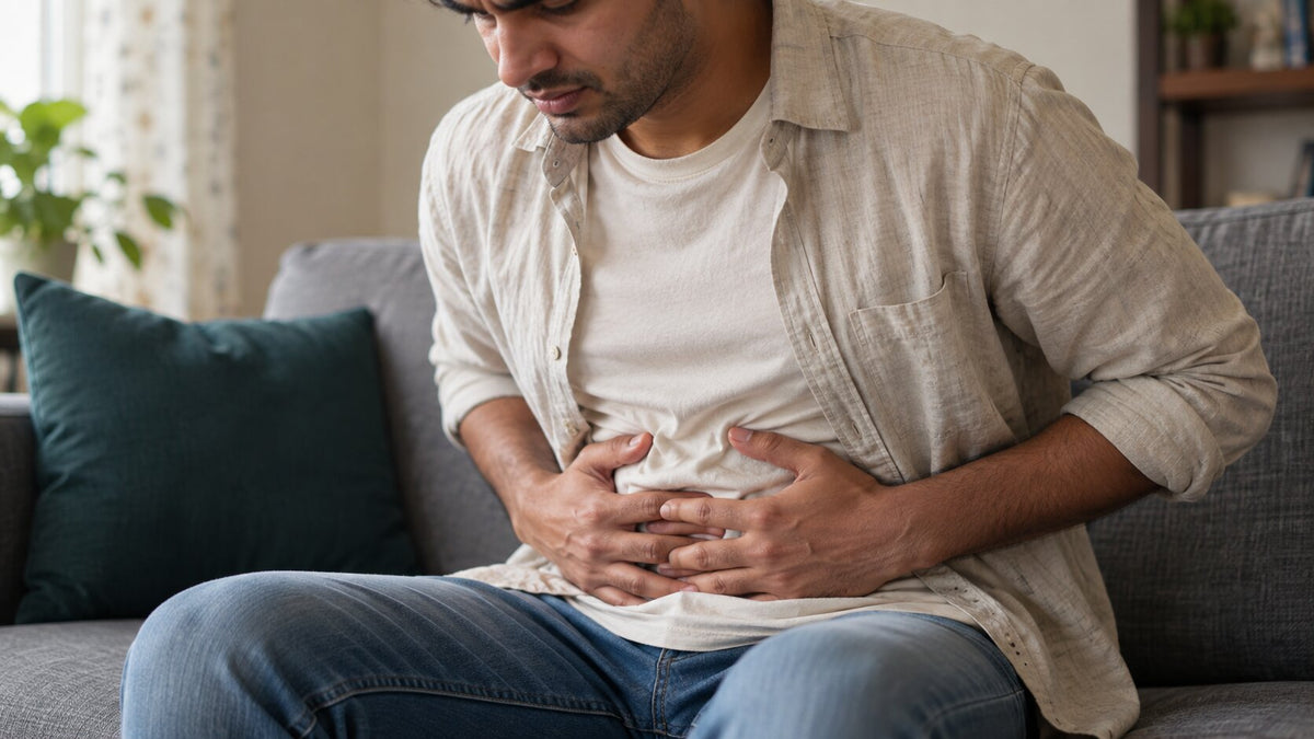 man suffering from stomach bloating